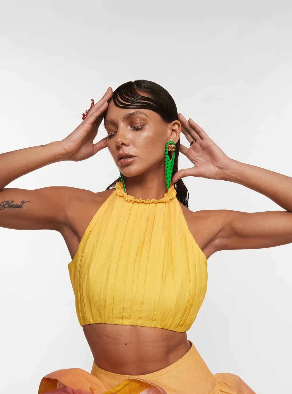 Halle Bailey Wearing Gavi Spicule Earrings In Green Leopard Enamel Finish